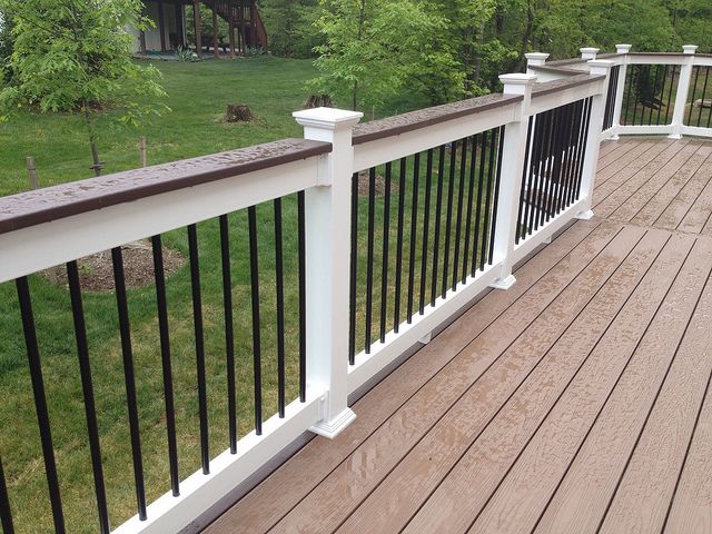 Deck railing repair with vinyl and aluminum Railing. Deck upgrade by Houston Remodeling Services.