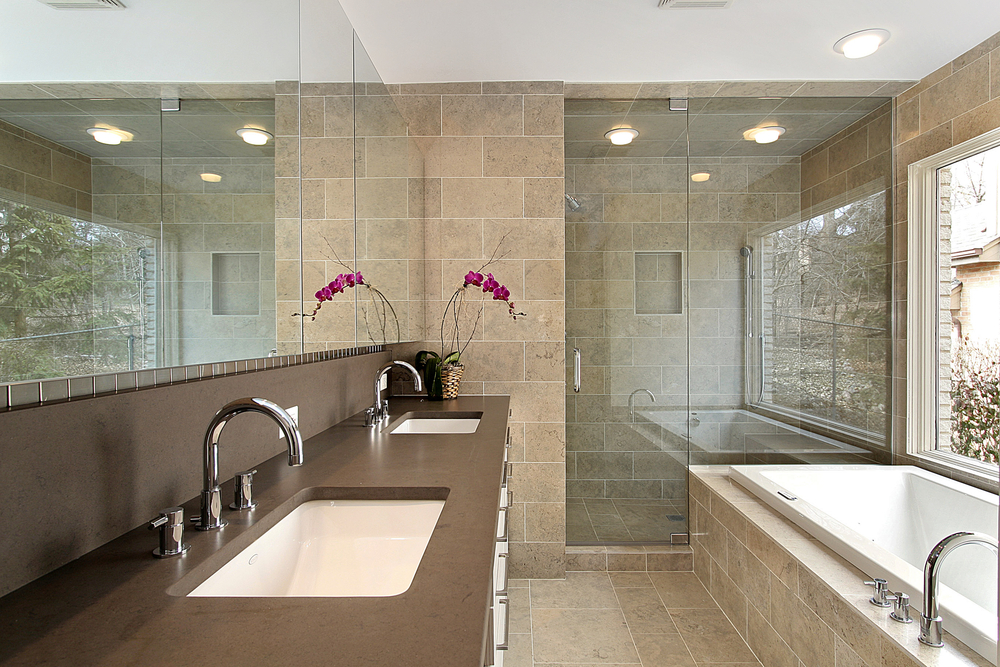 A bathroom installation that includes two sinks, a bathtub, and a shower.