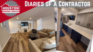 Our completed basement renovation project includes two couches, a table, a TV entertainment system, plus a kitchen set up that includes a counter, a refrigerator, and cabinets.